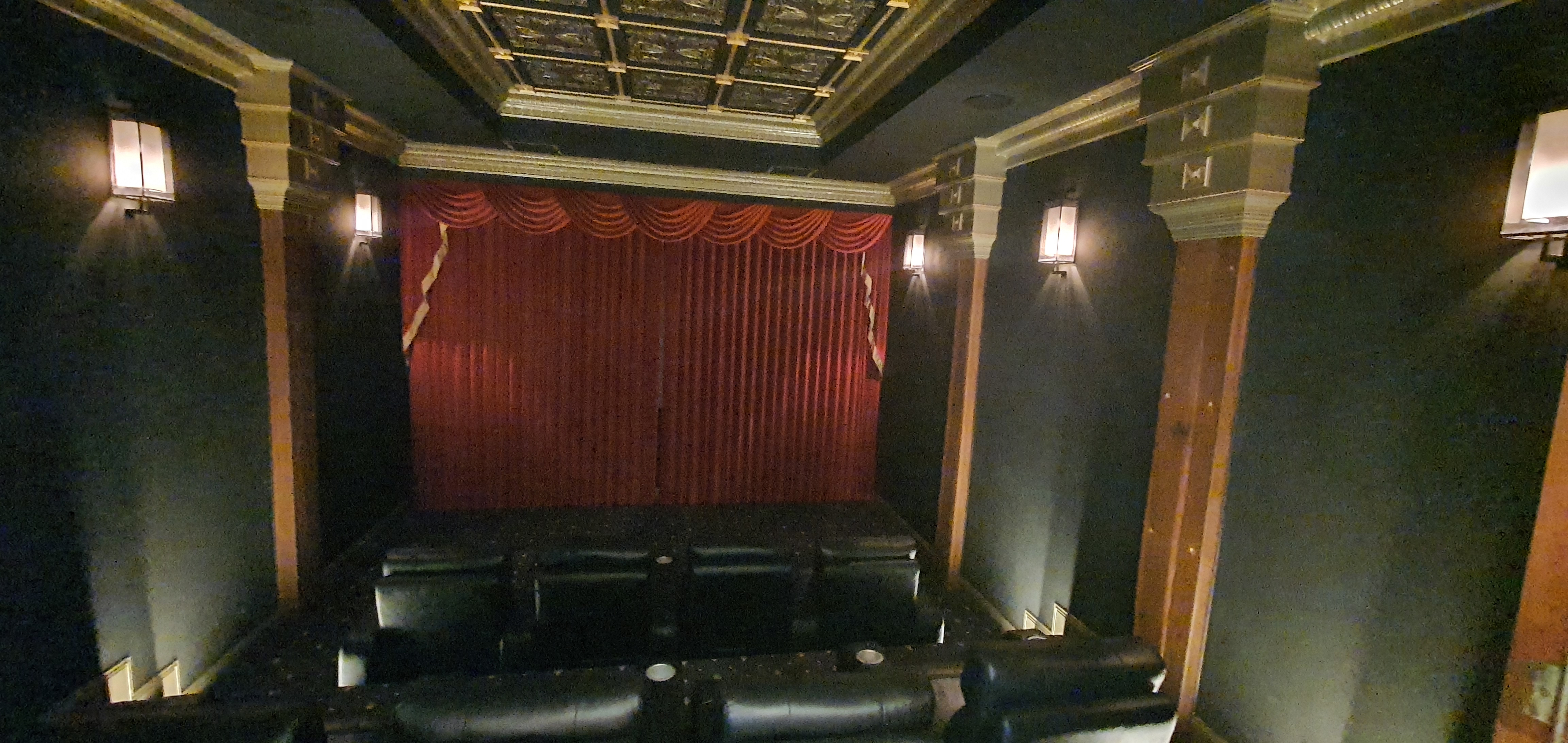 Home Cinema with Theatre style curtains closed covering the projection screen